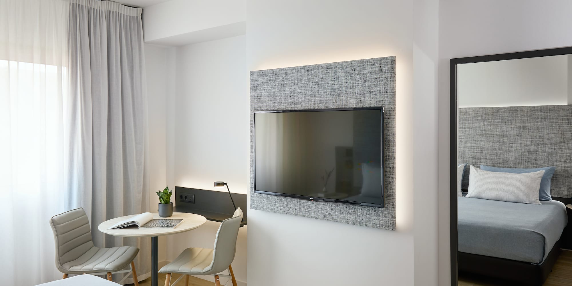 a room with a tv on the wall