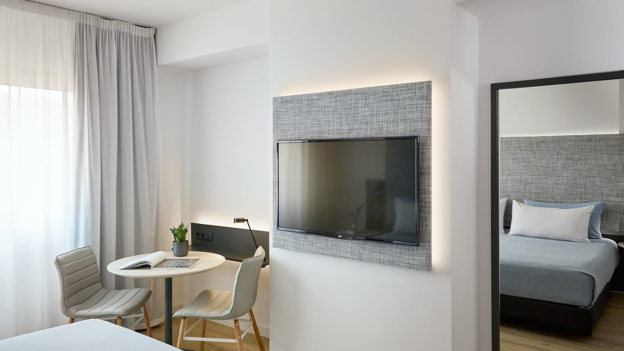 a room with a tv on the wall