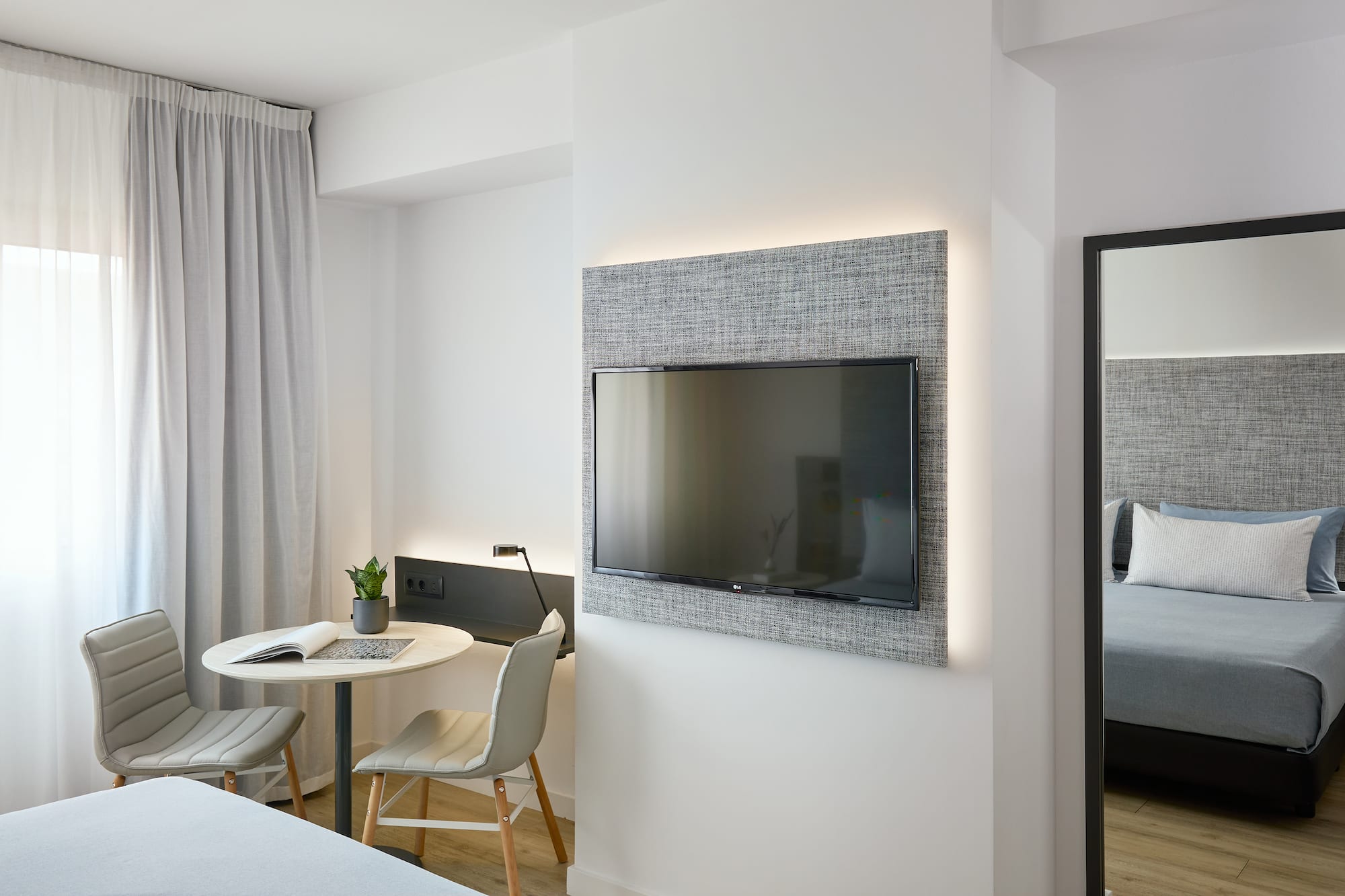 a room with a tv on the wall