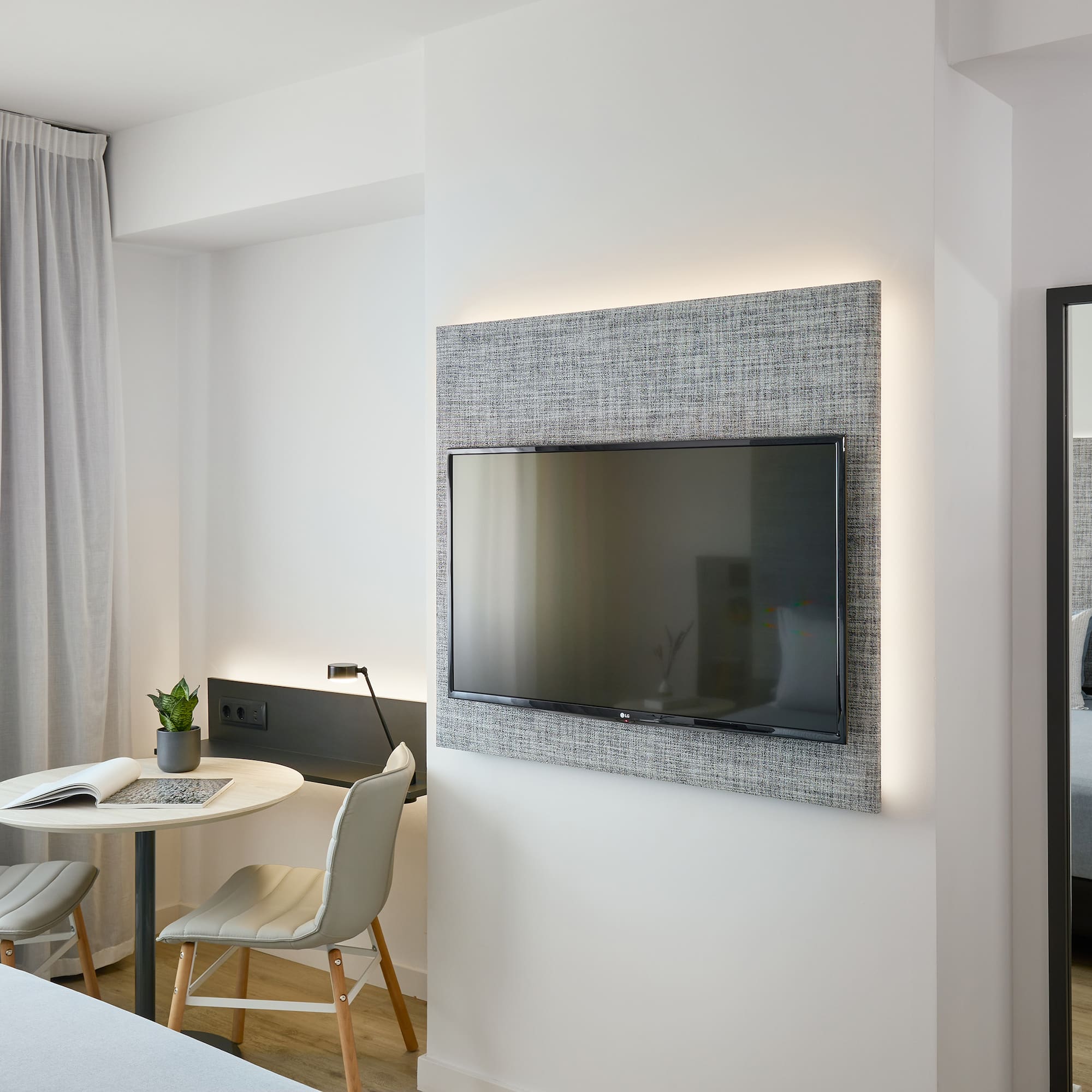 a room with a tv on the wall
