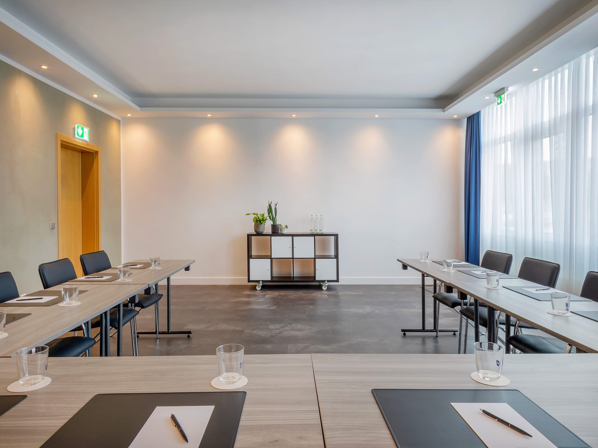 a room with tables and chairs