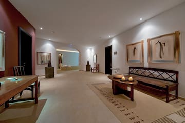 a room with a bench and a table