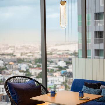 a table with blue pillows and a blue cushion