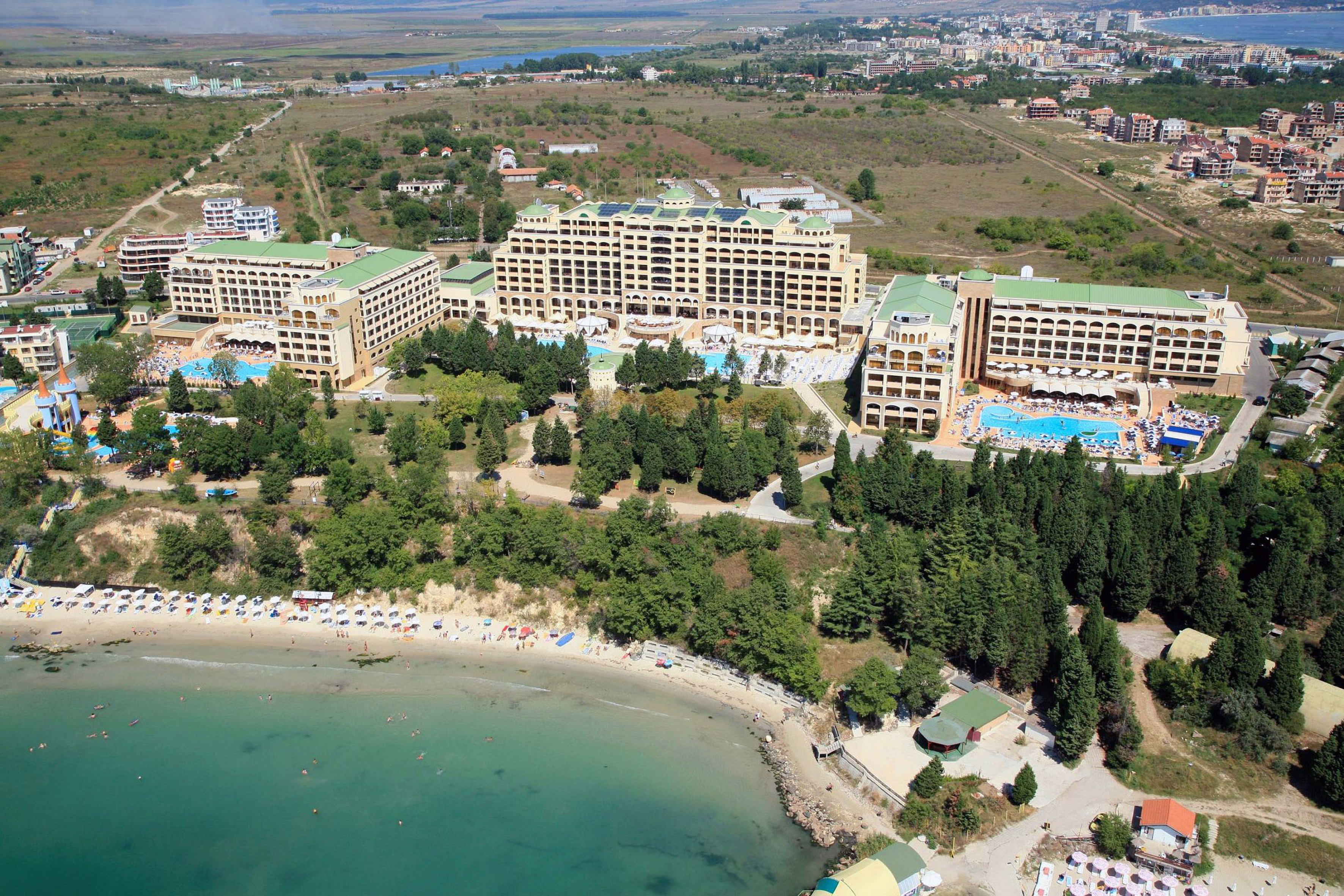 a aerial view of a beach with buildings and trees