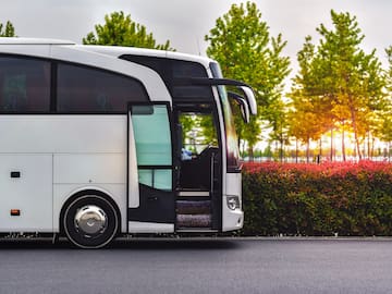 a white bus with the door open