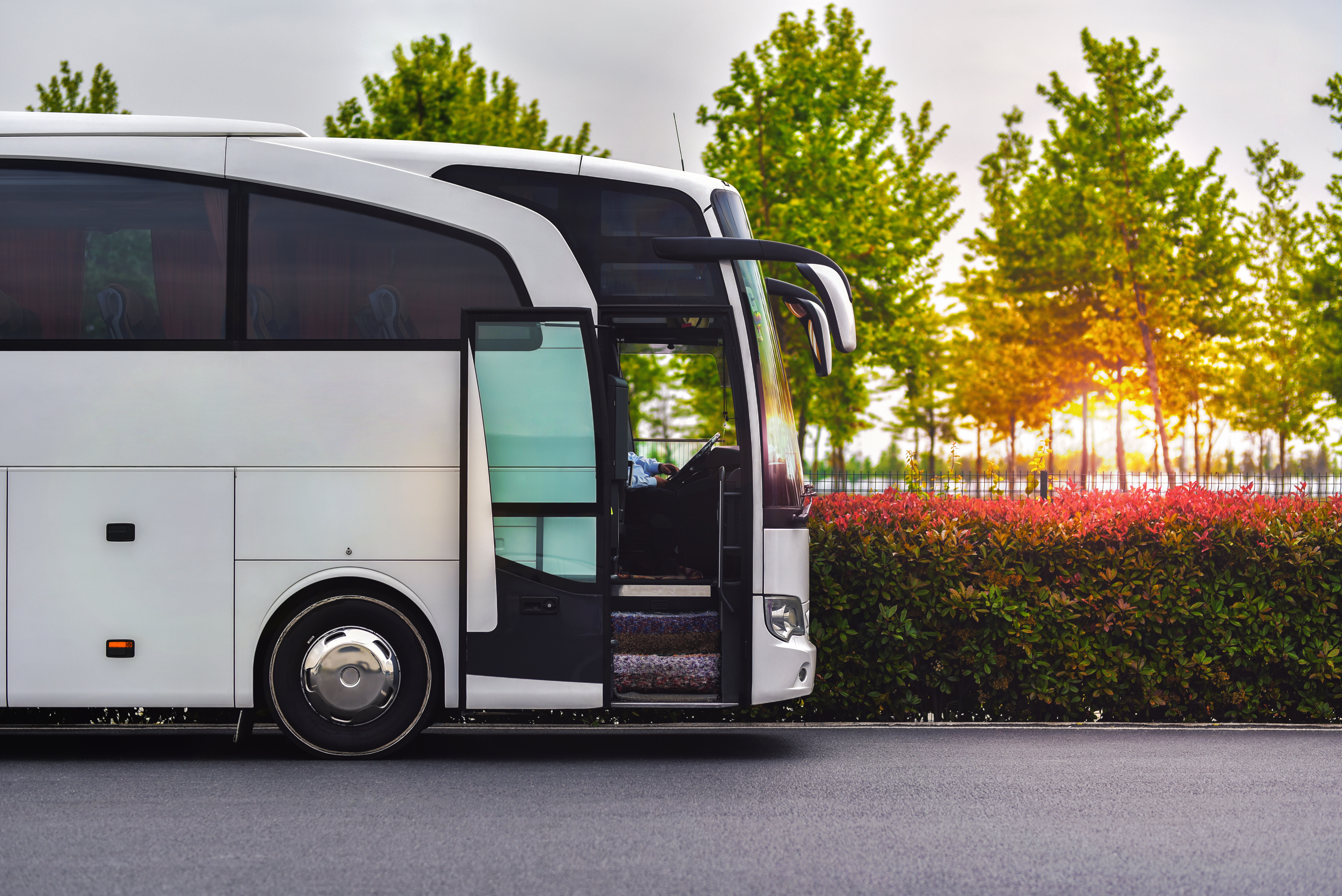 a white bus with the door open