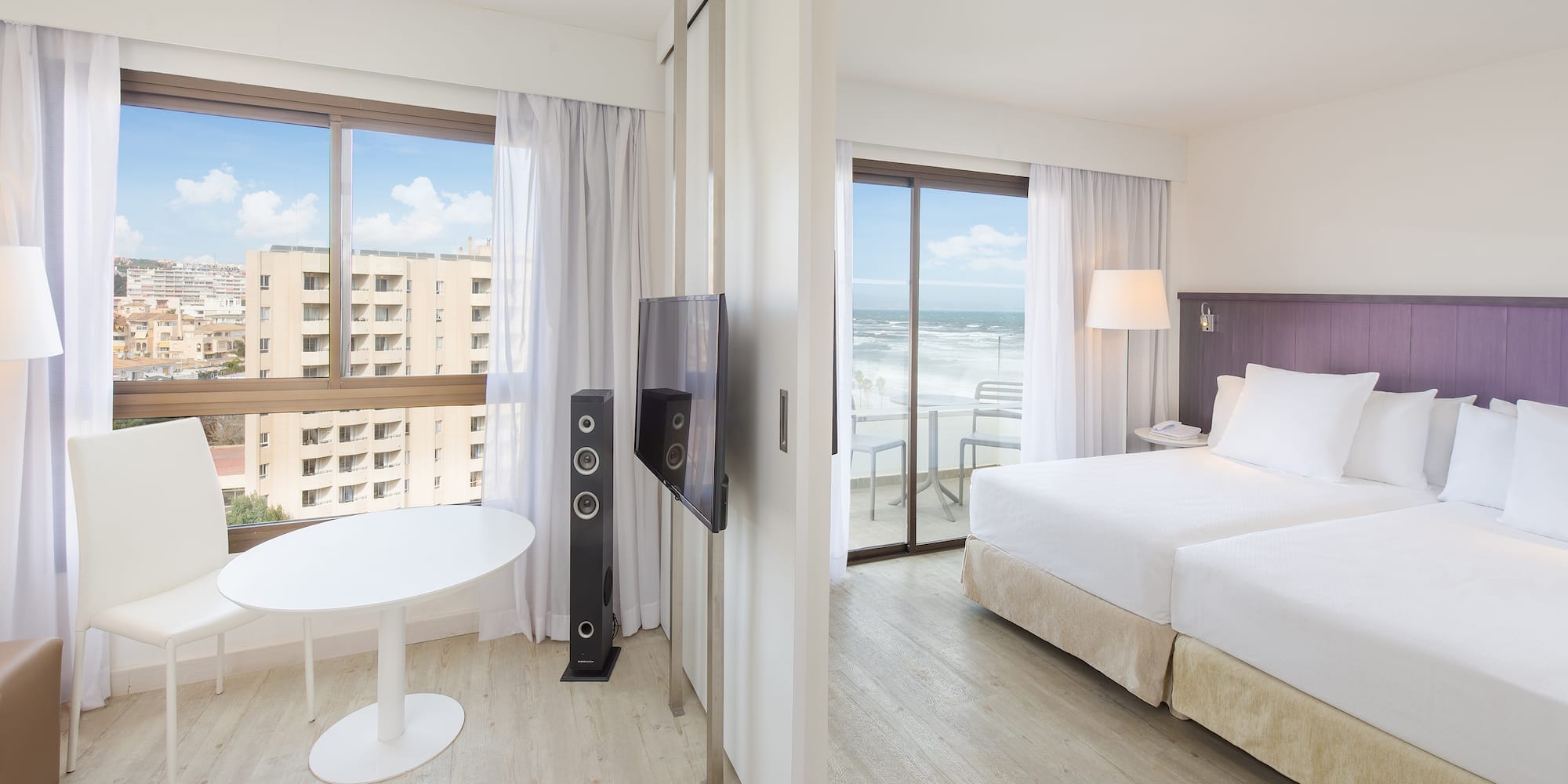 a room with a bed and a television