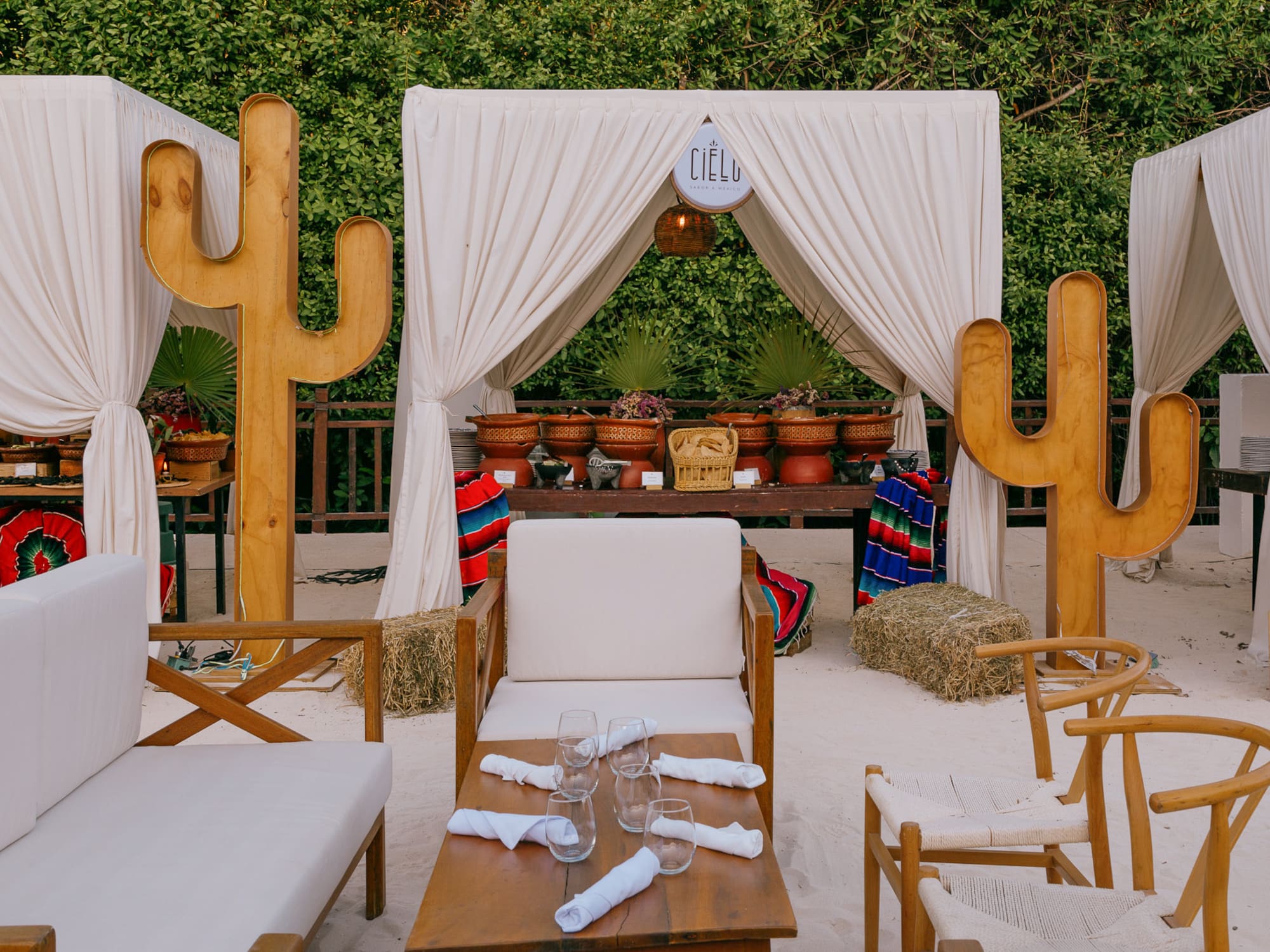 a table and chairs in a desert setting
