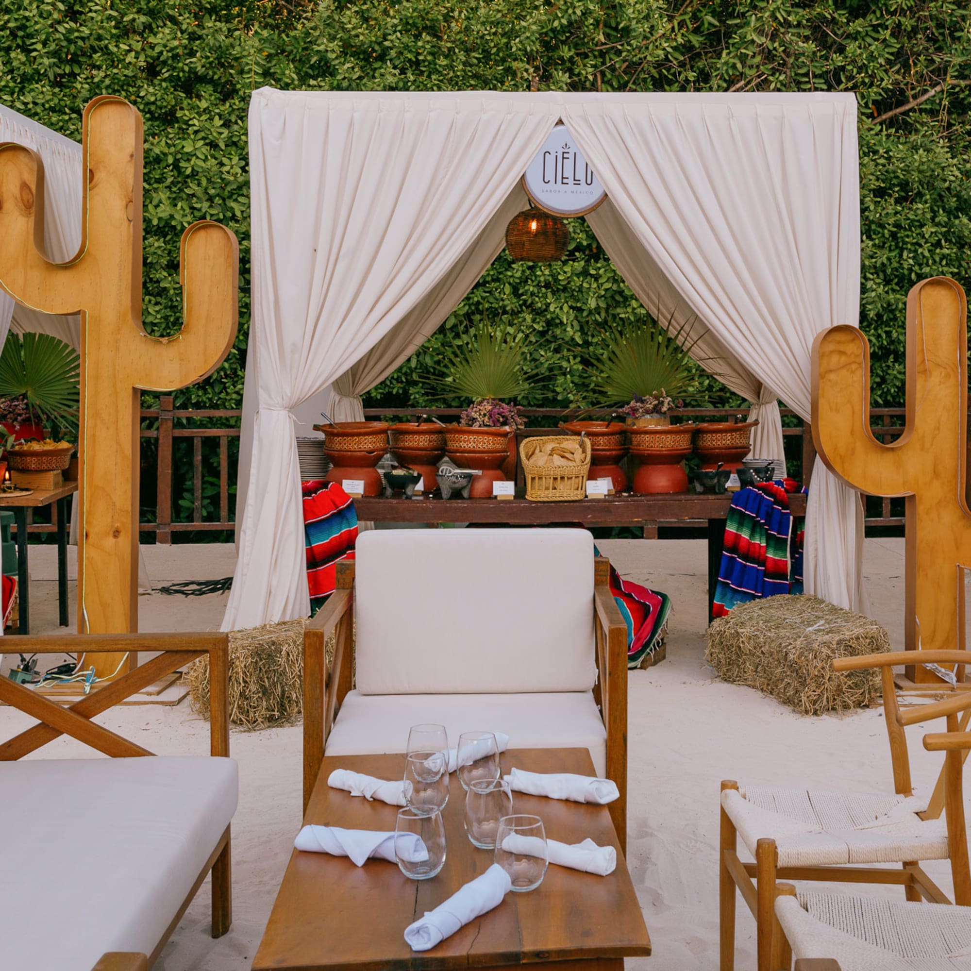 a table and chairs in a desert setting