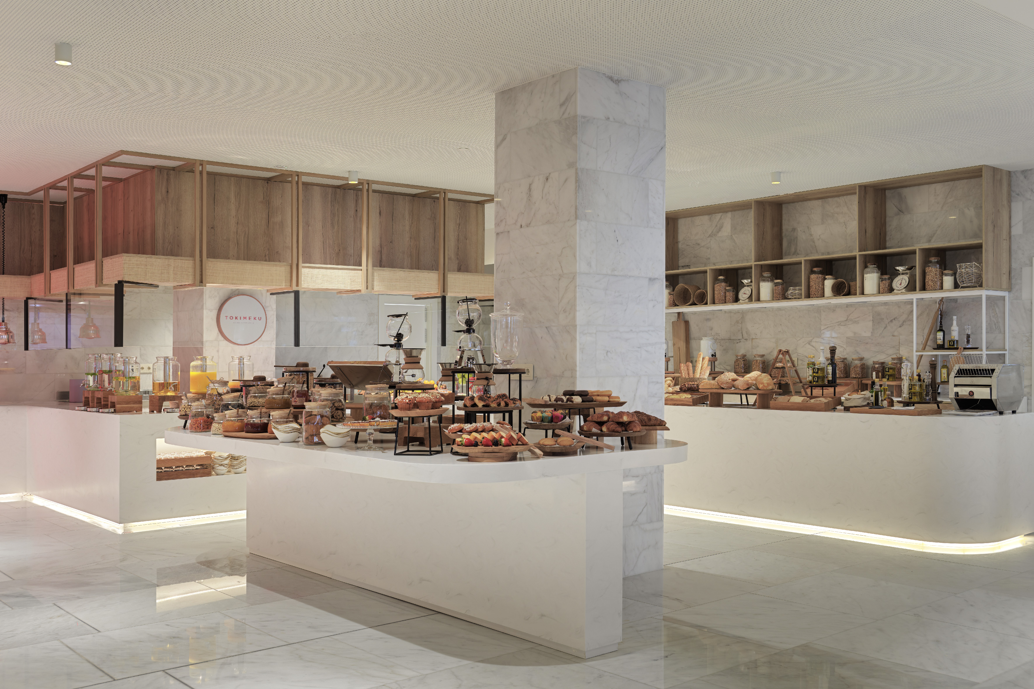 Tokimeku breakfast buffet with pastries, fresh fruit, juices, and bakery items.