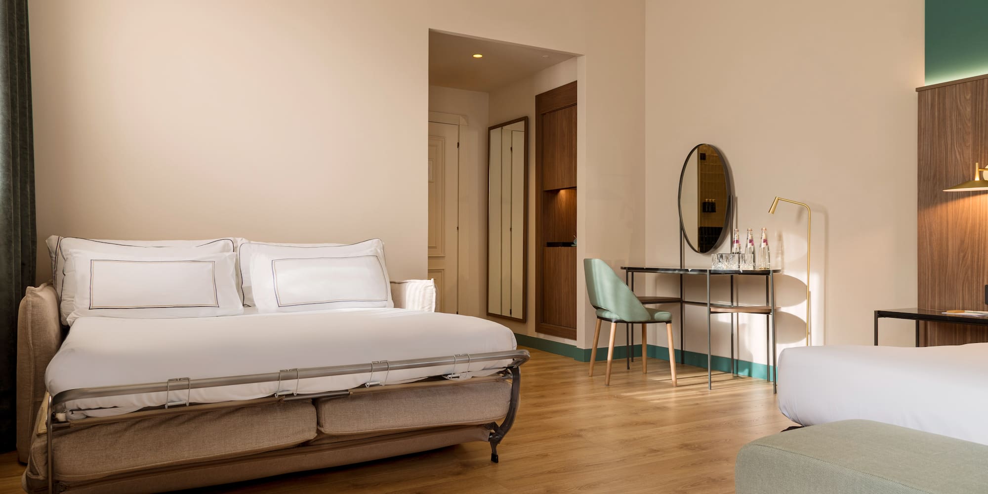 a bedroom with a bed and a mirror