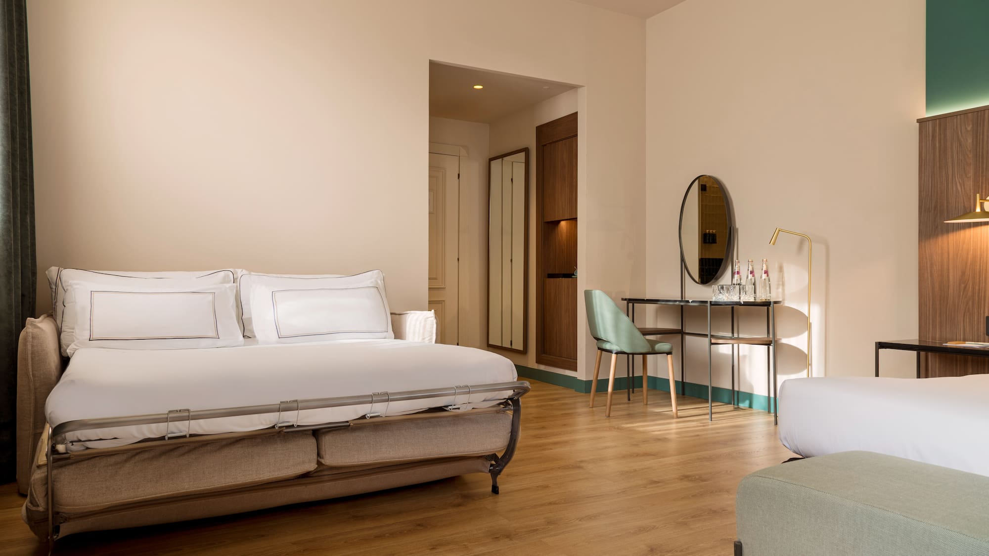 a bedroom with a bed and a mirror