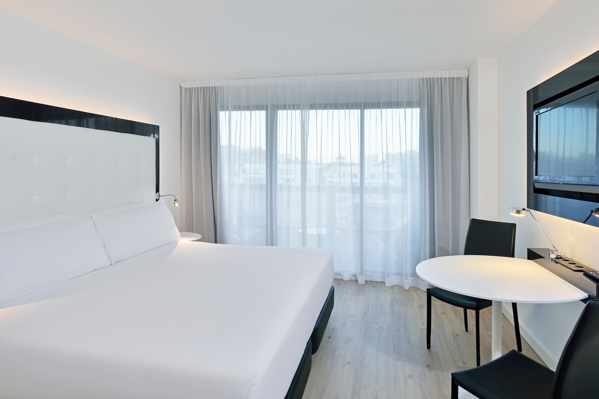 a room with a bed and a table