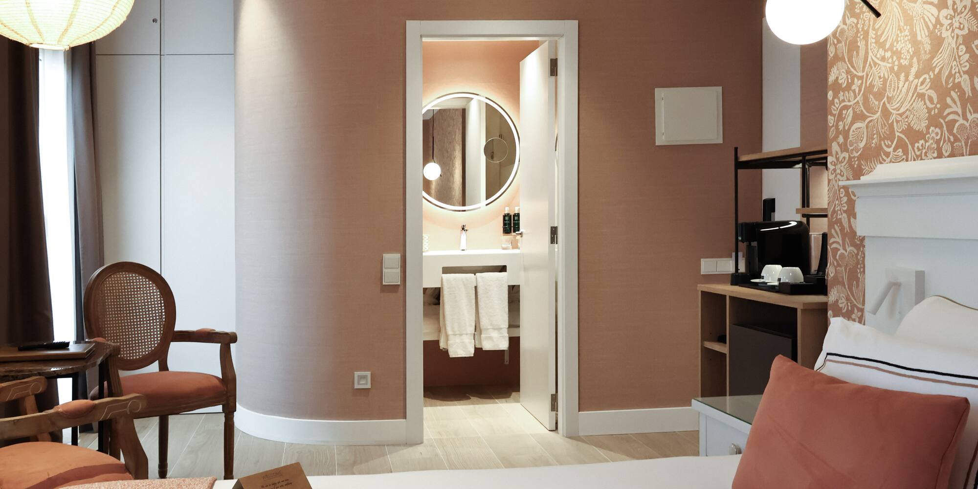 a room with a bed and a mirror