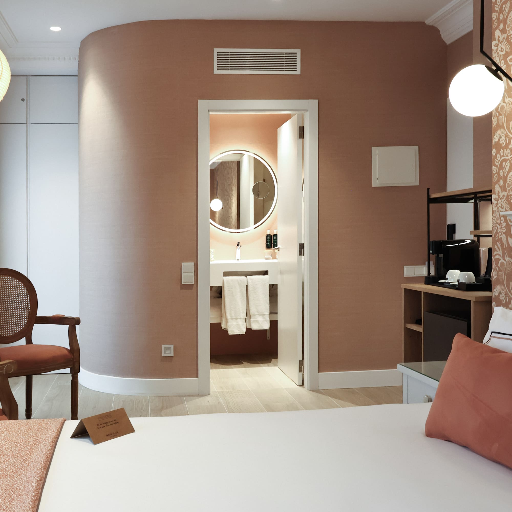 a room with a bed and a mirror