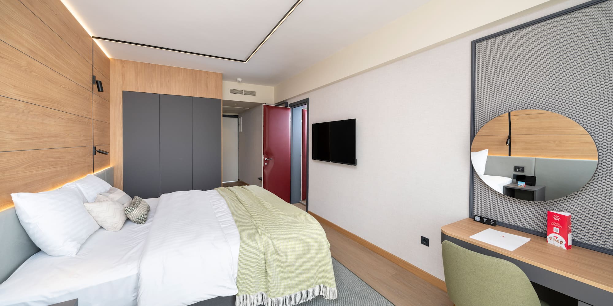 a bedroom with a bed and a desk