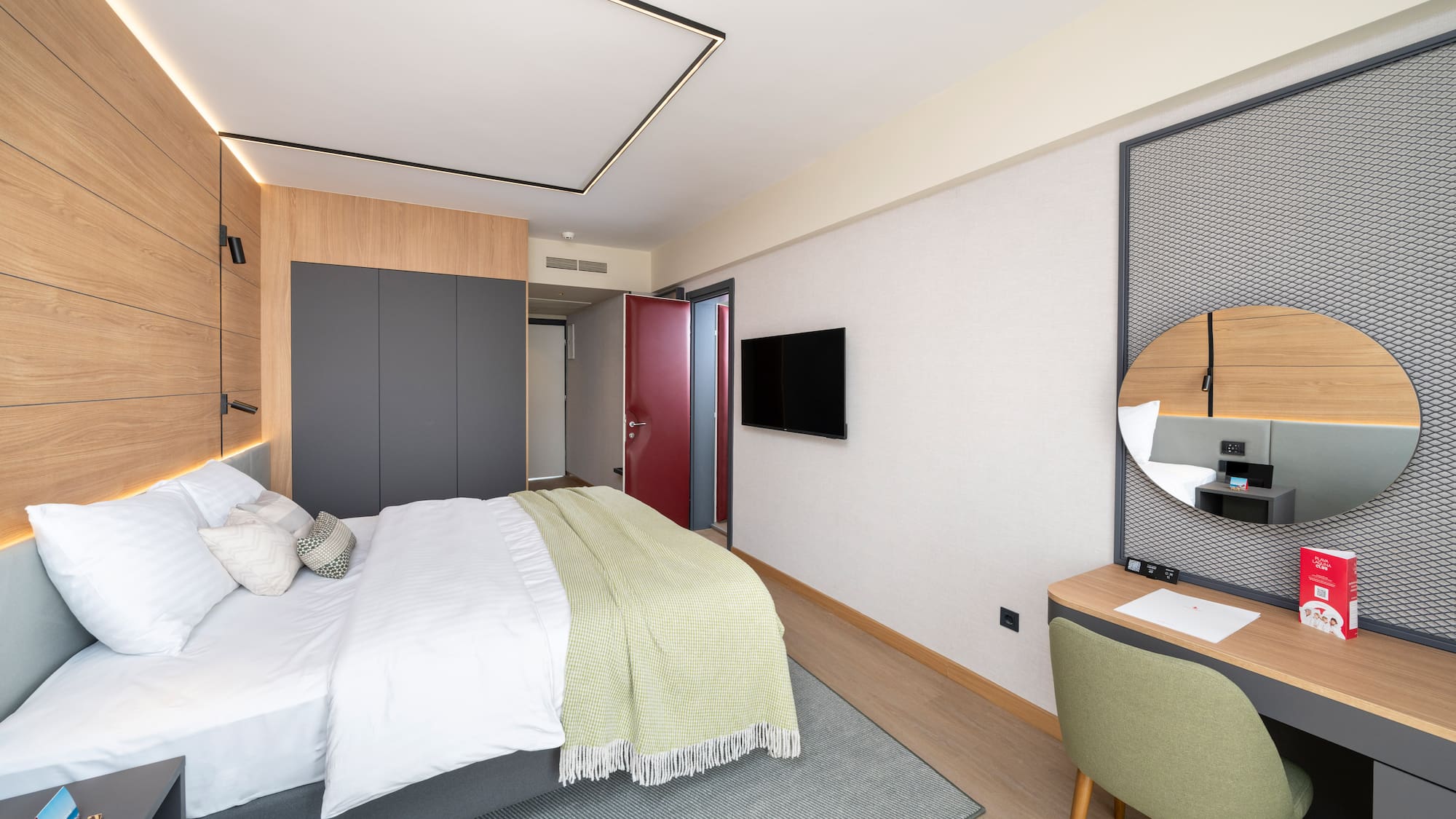 a bedroom with a bed and a desk