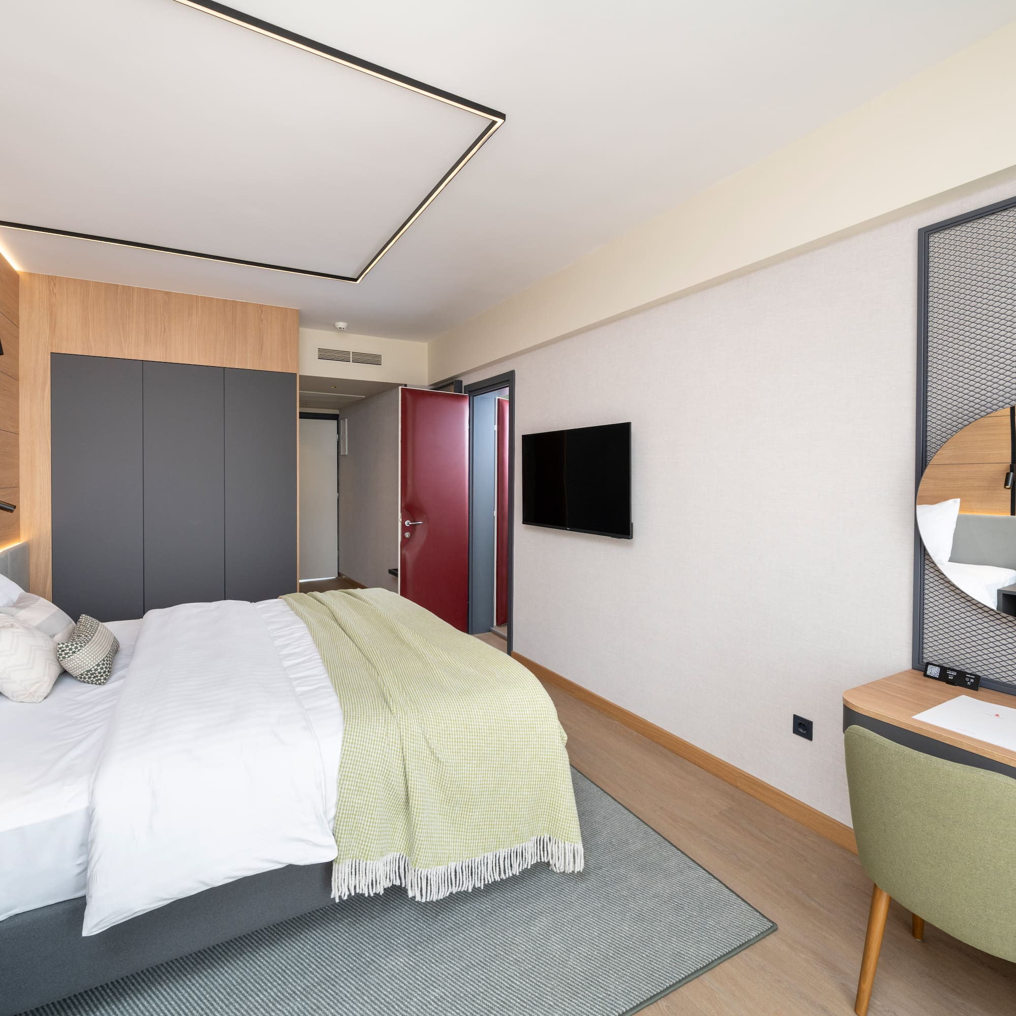 a bedroom with a bed and a desk