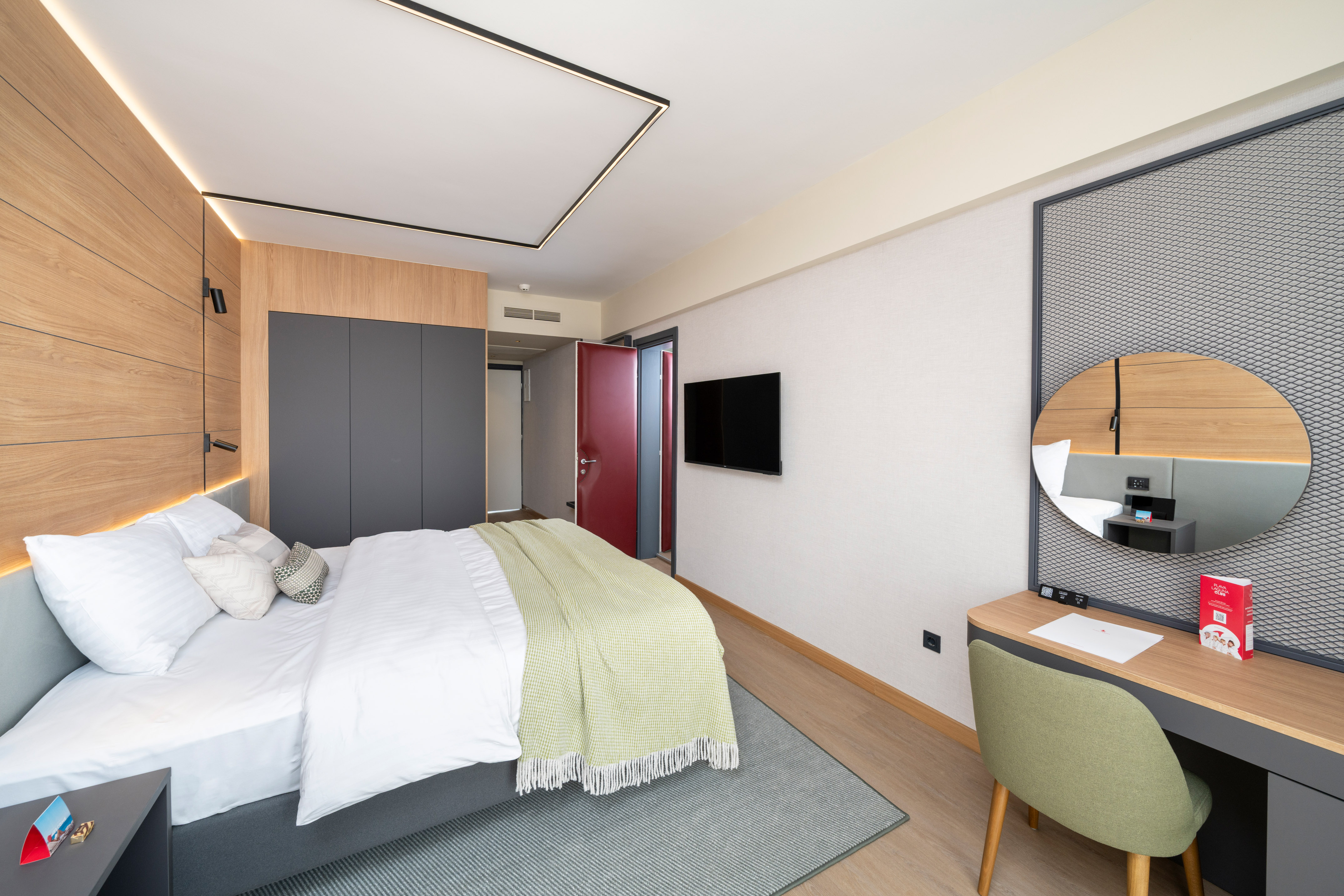 a bedroom with a bed and a desk