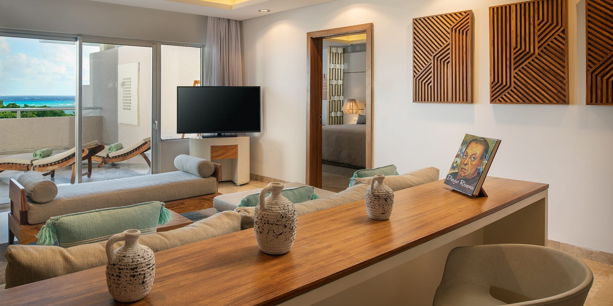 a living room with a television and a table