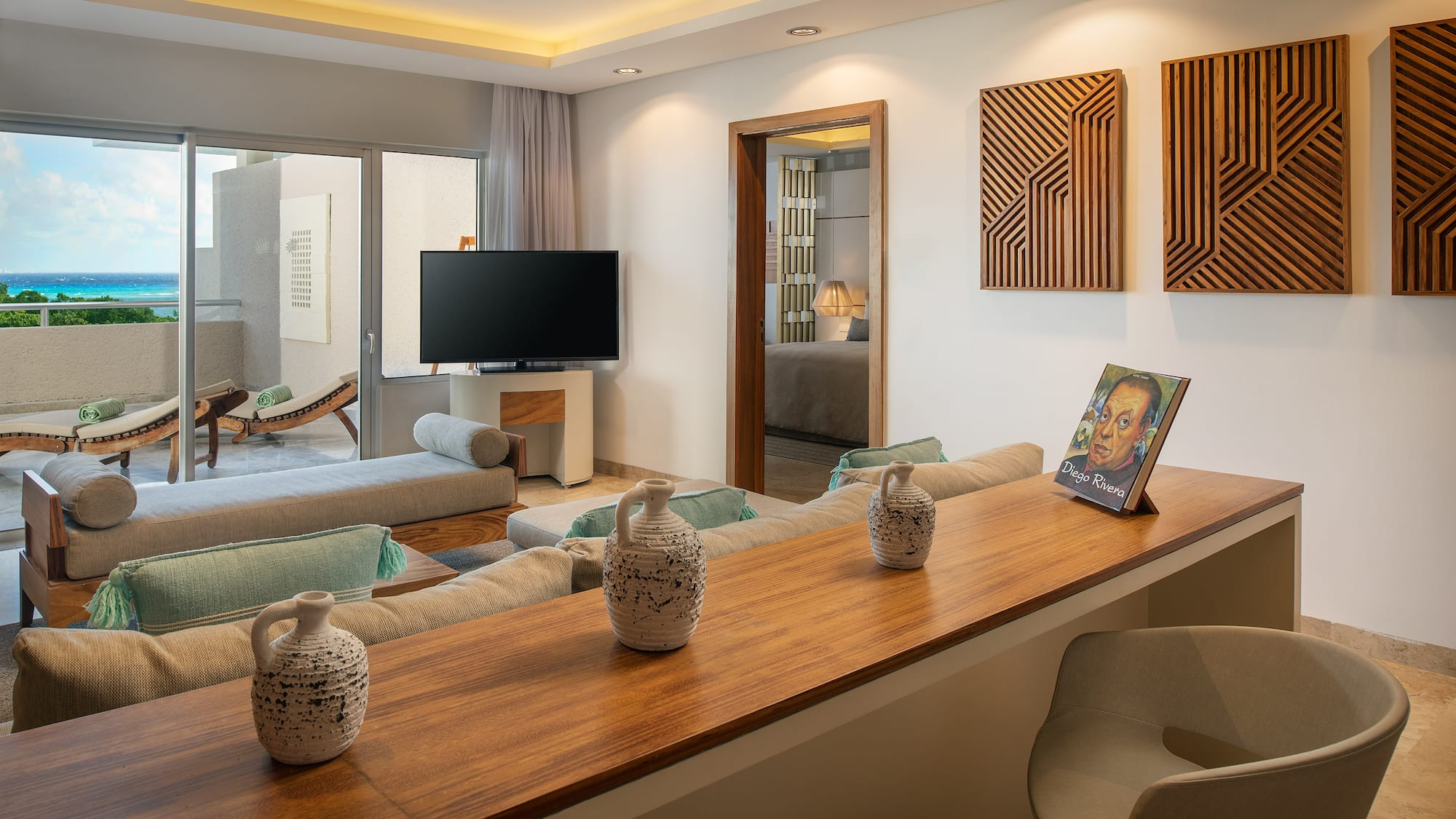 a living room with a television and a table