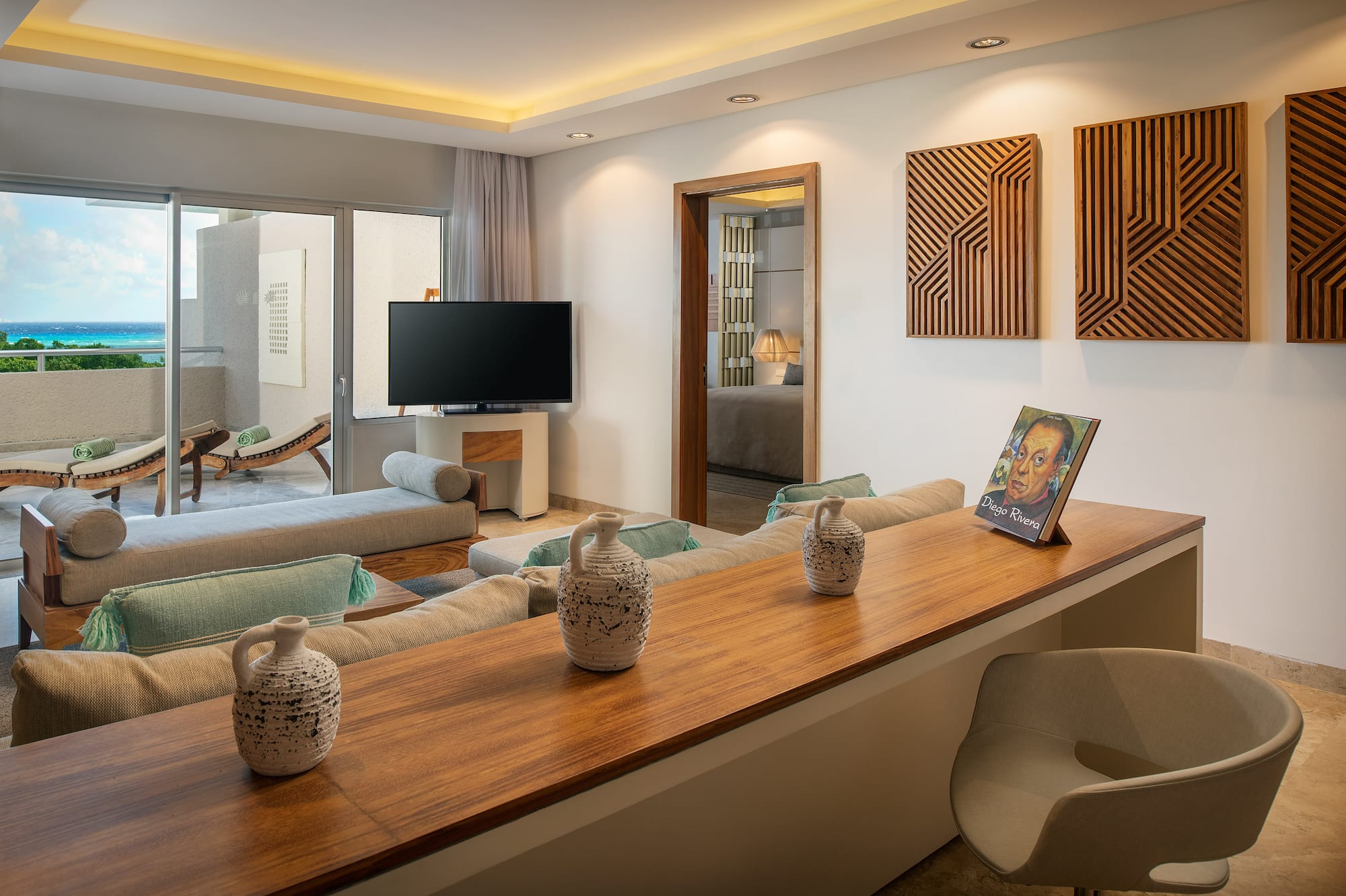 a living room with a television and a table