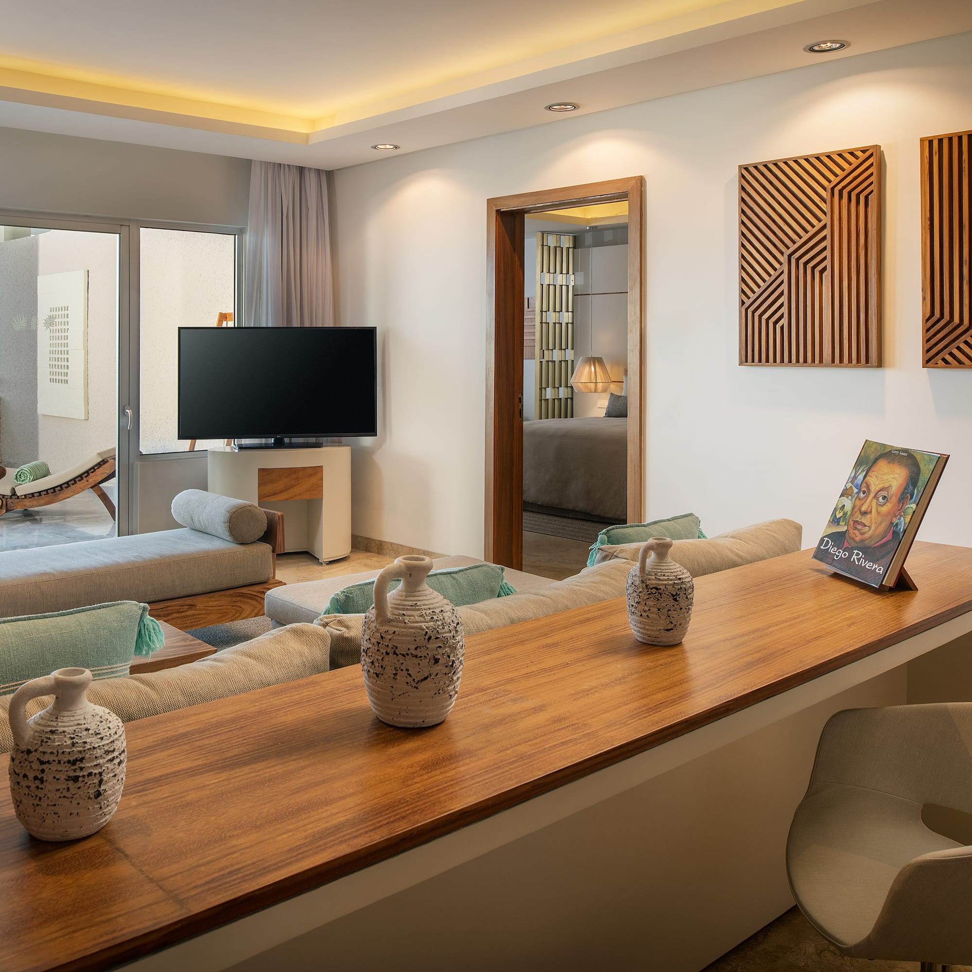 a living room with a television and a table