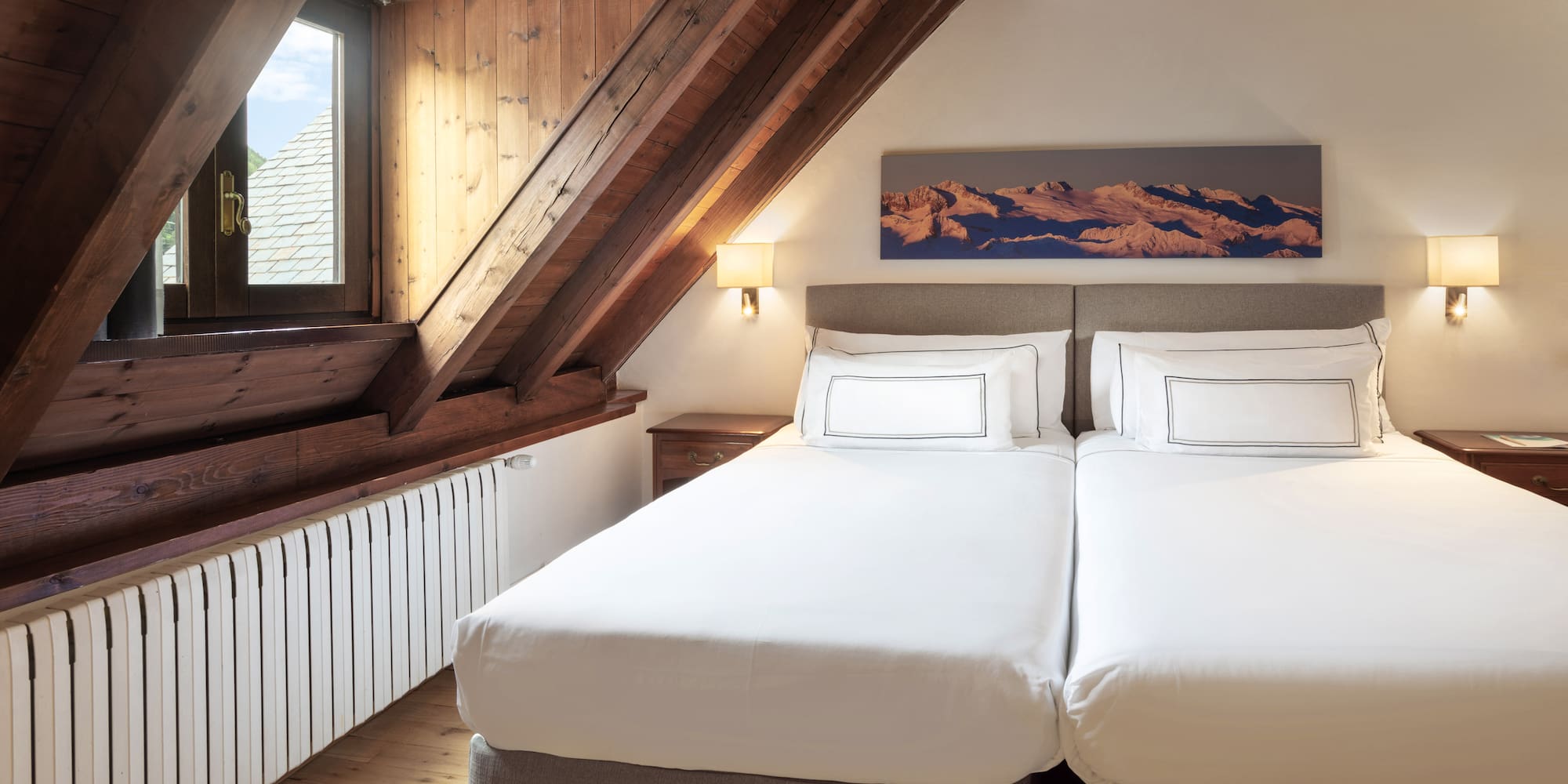 a bedroom with a wooden ceiling and a window