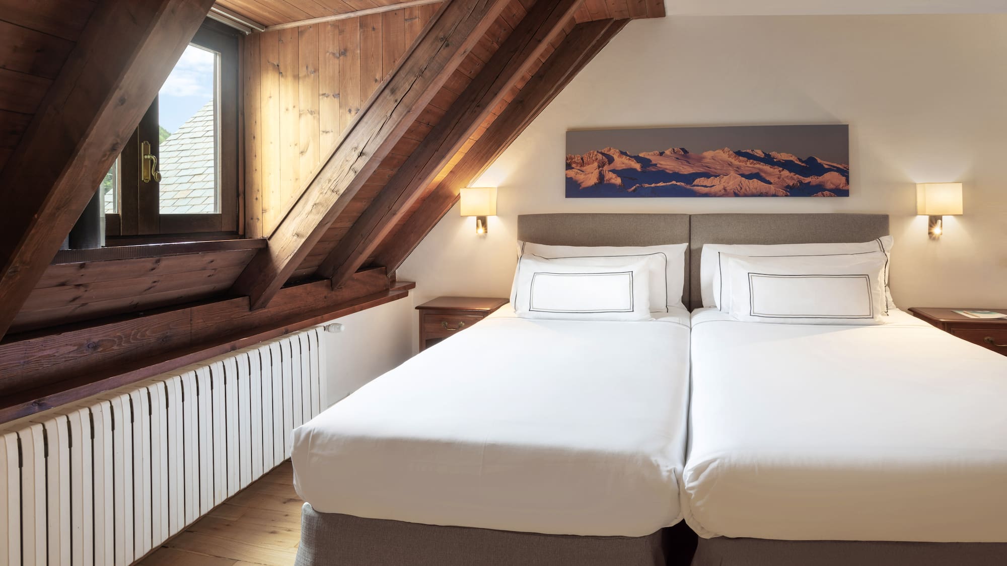 a bedroom with a wooden ceiling and a window