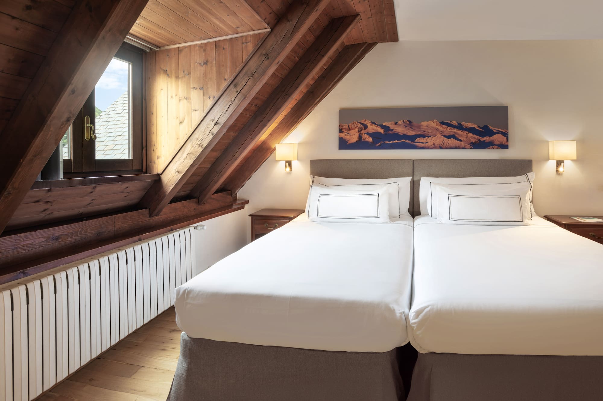 a bedroom with a wooden ceiling and a window