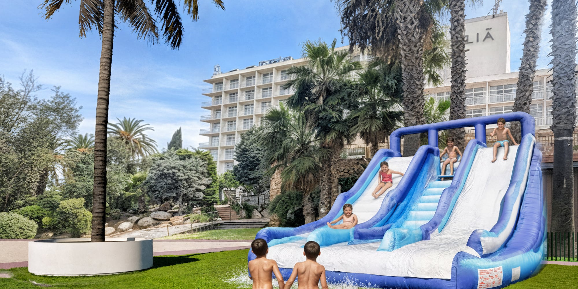 a group of kids playing on a water slide