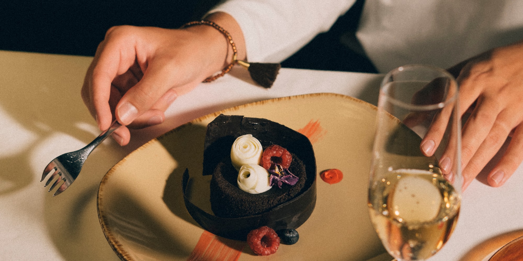 a person eating a dessert on a plate