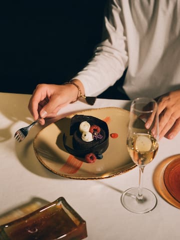 a person eating a dessert on a plate