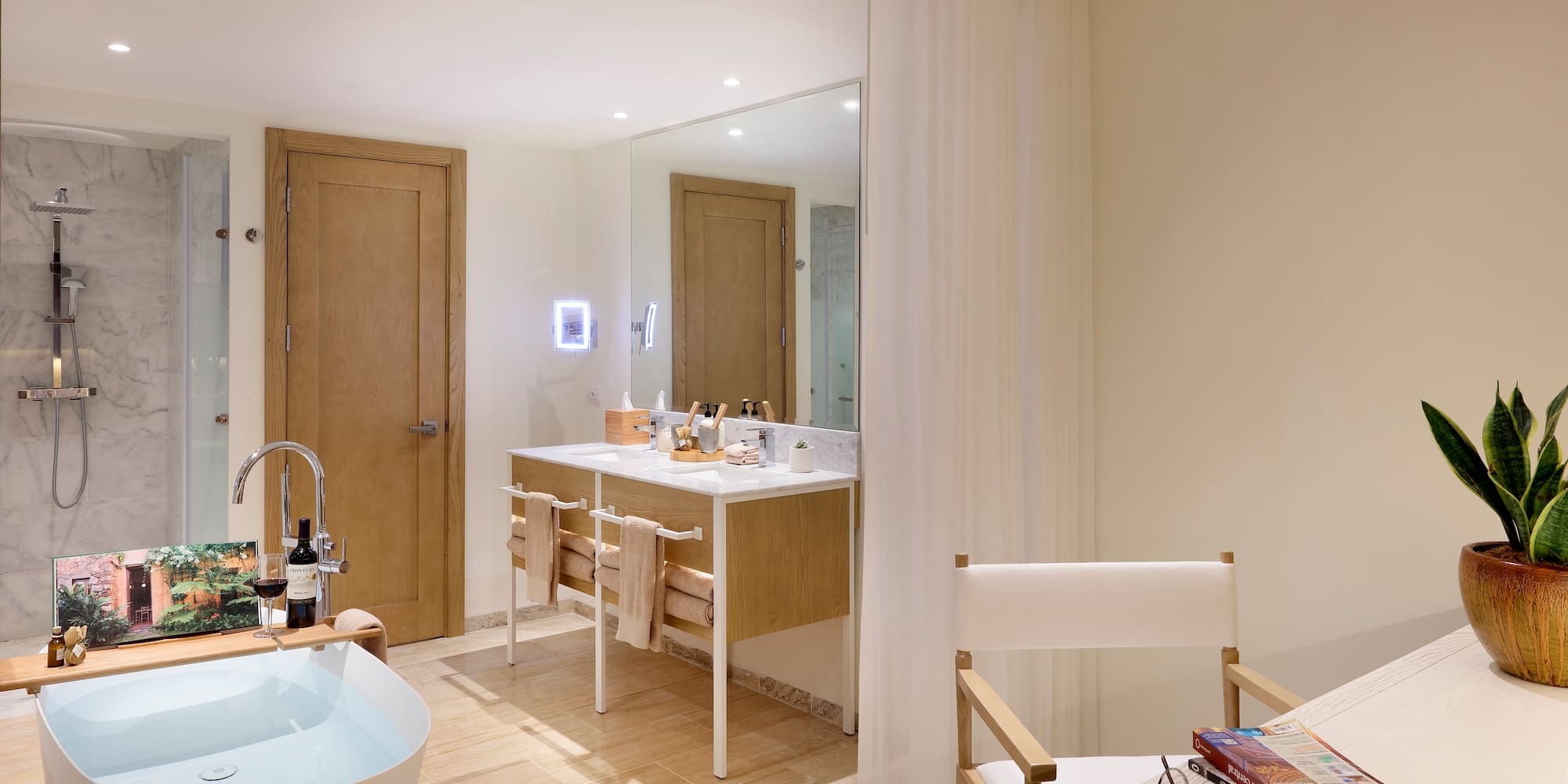 a bathroom with a white tub and a white table