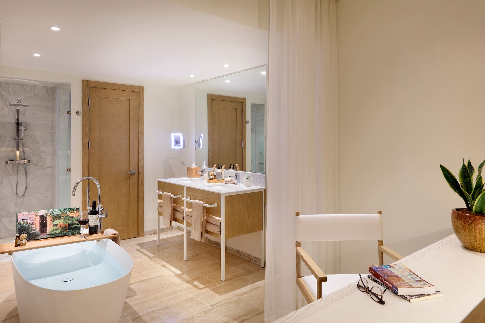 a bathroom with a white tub and a white table