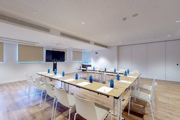 a room with tables and chairs