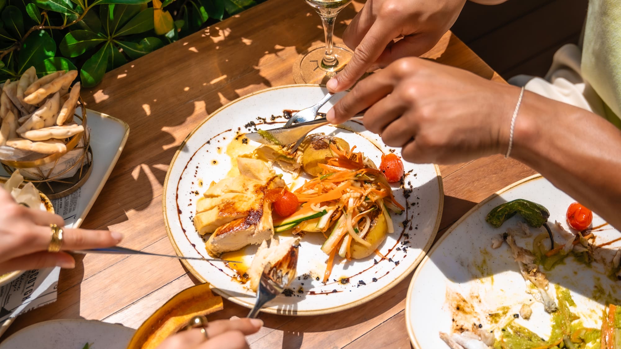 a group of people eating food at a table