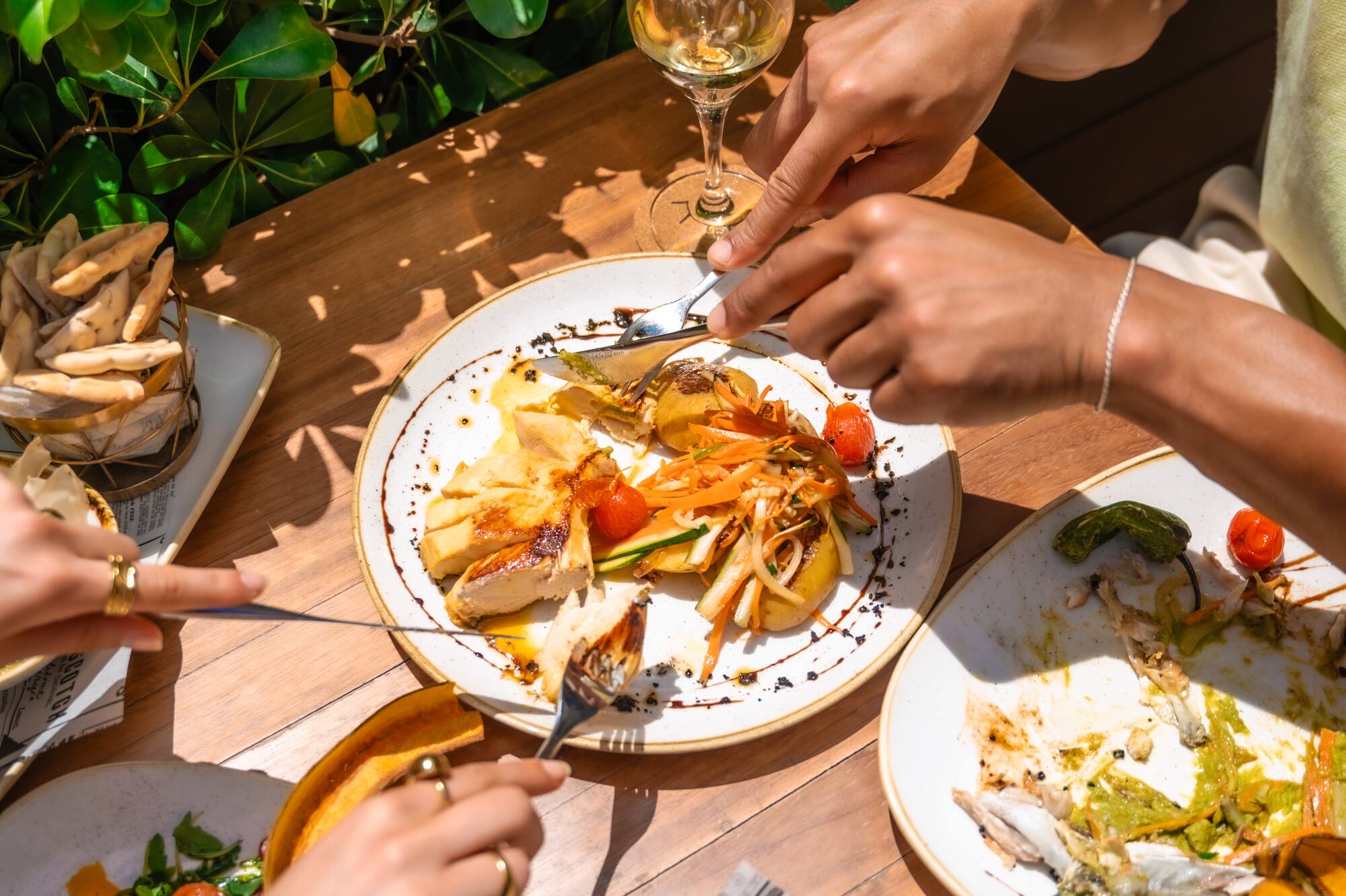 a group of people eating food at a table
