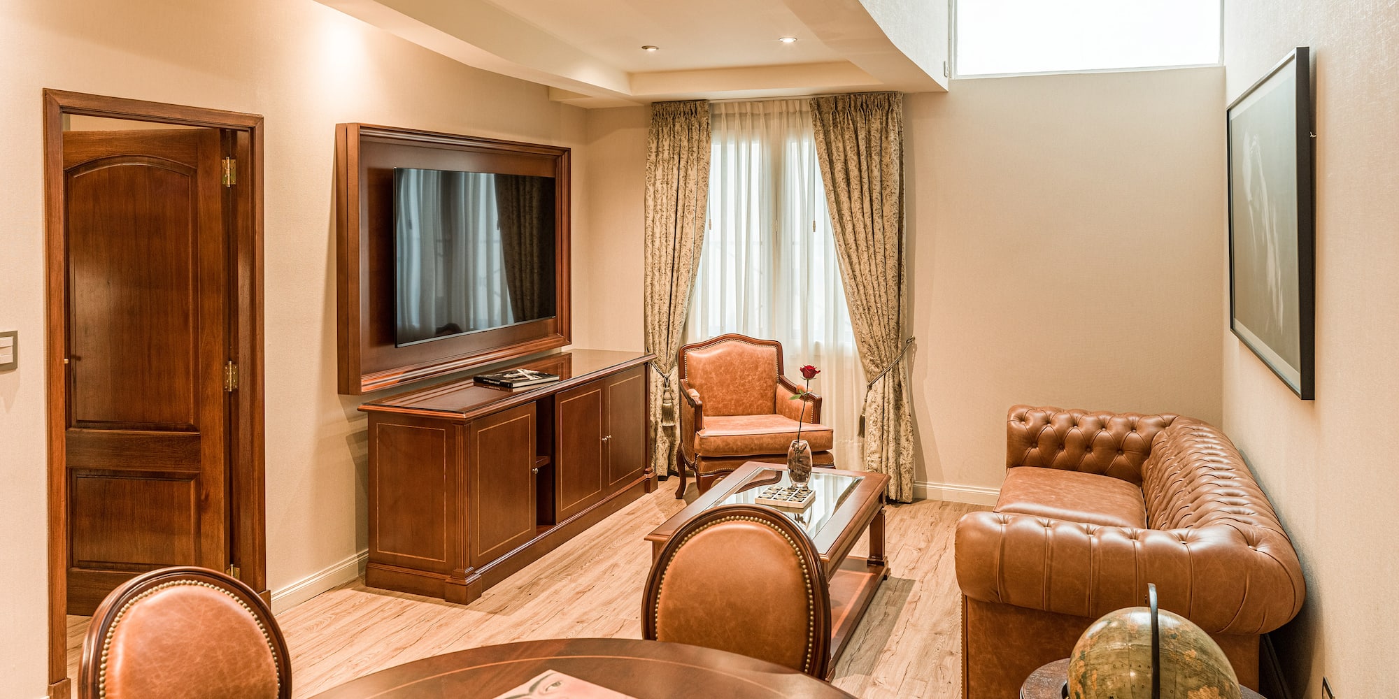 a room with a television and couches