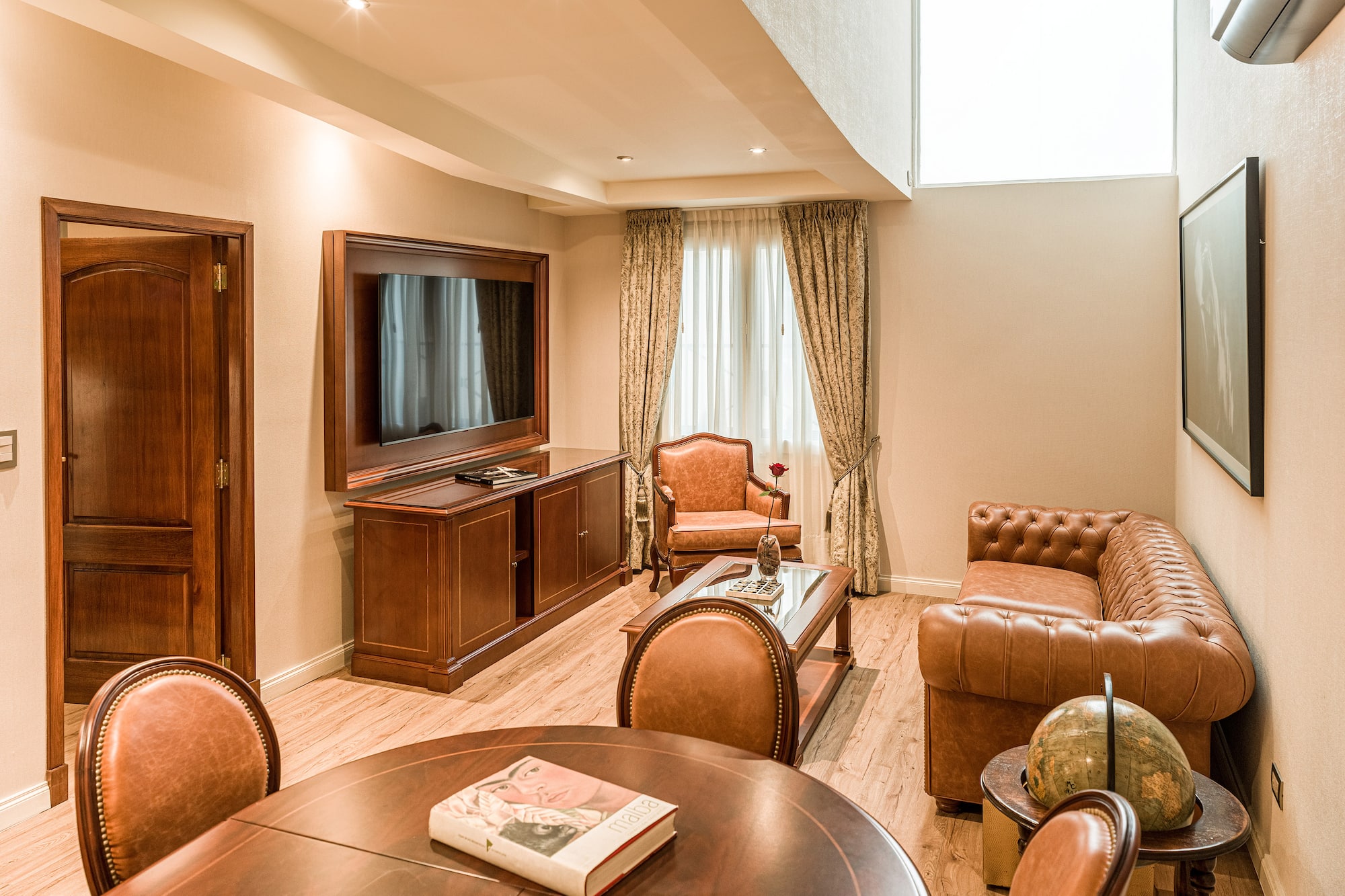 a room with a television and couches