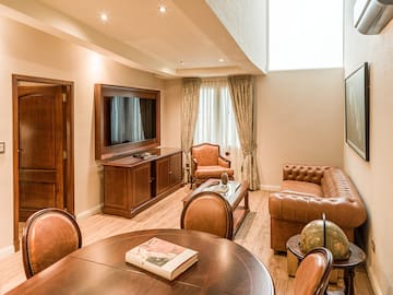 a room with a television and couches