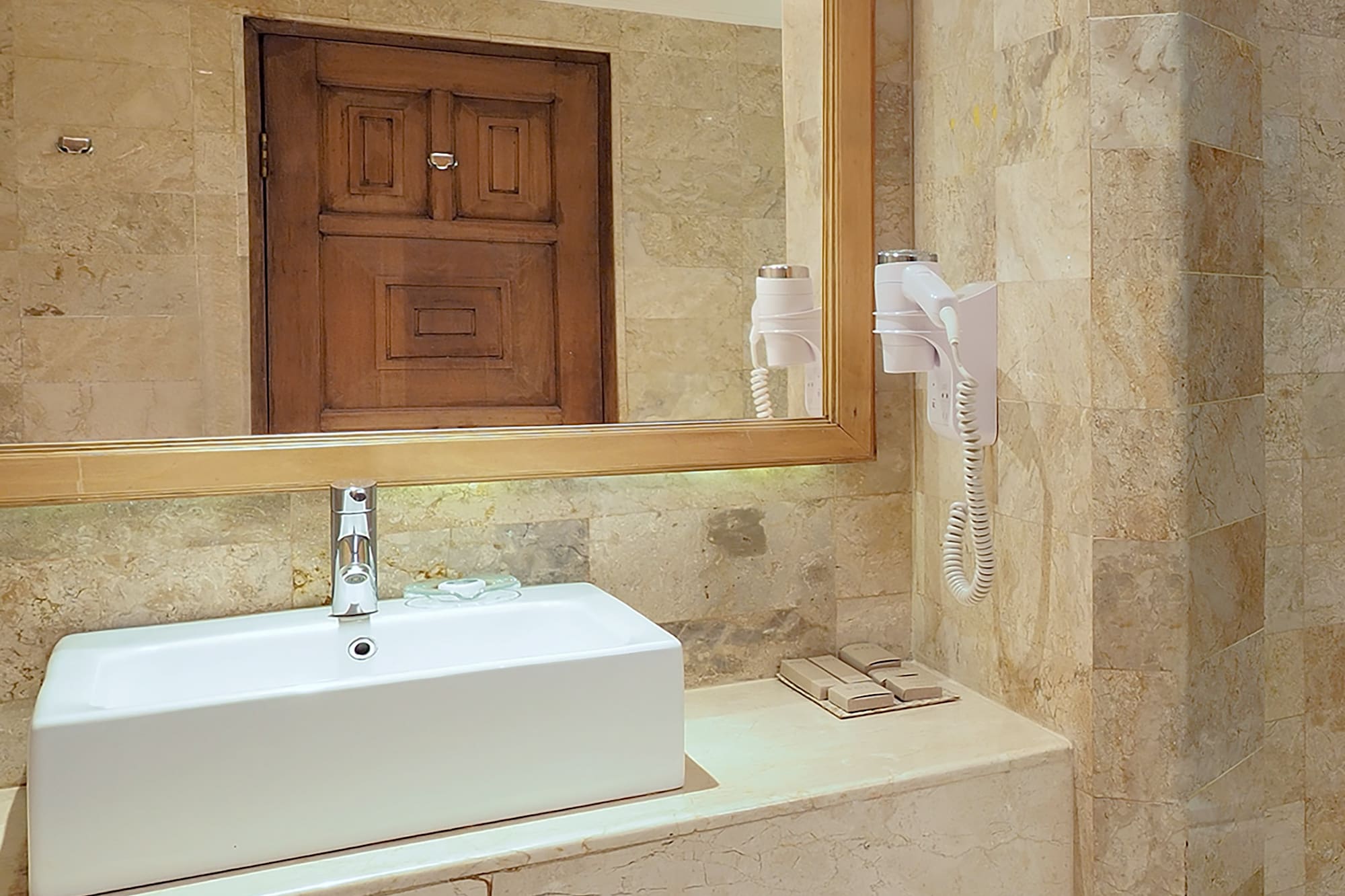 a bathroom with a mirror and sink