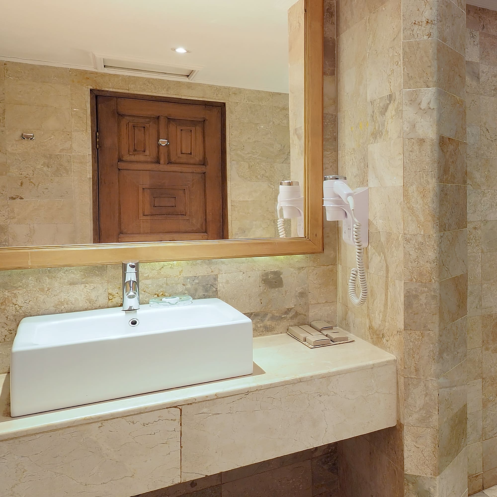 a bathroom with a mirror and sink