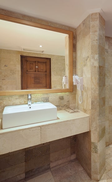 a bathroom with a mirror and sink