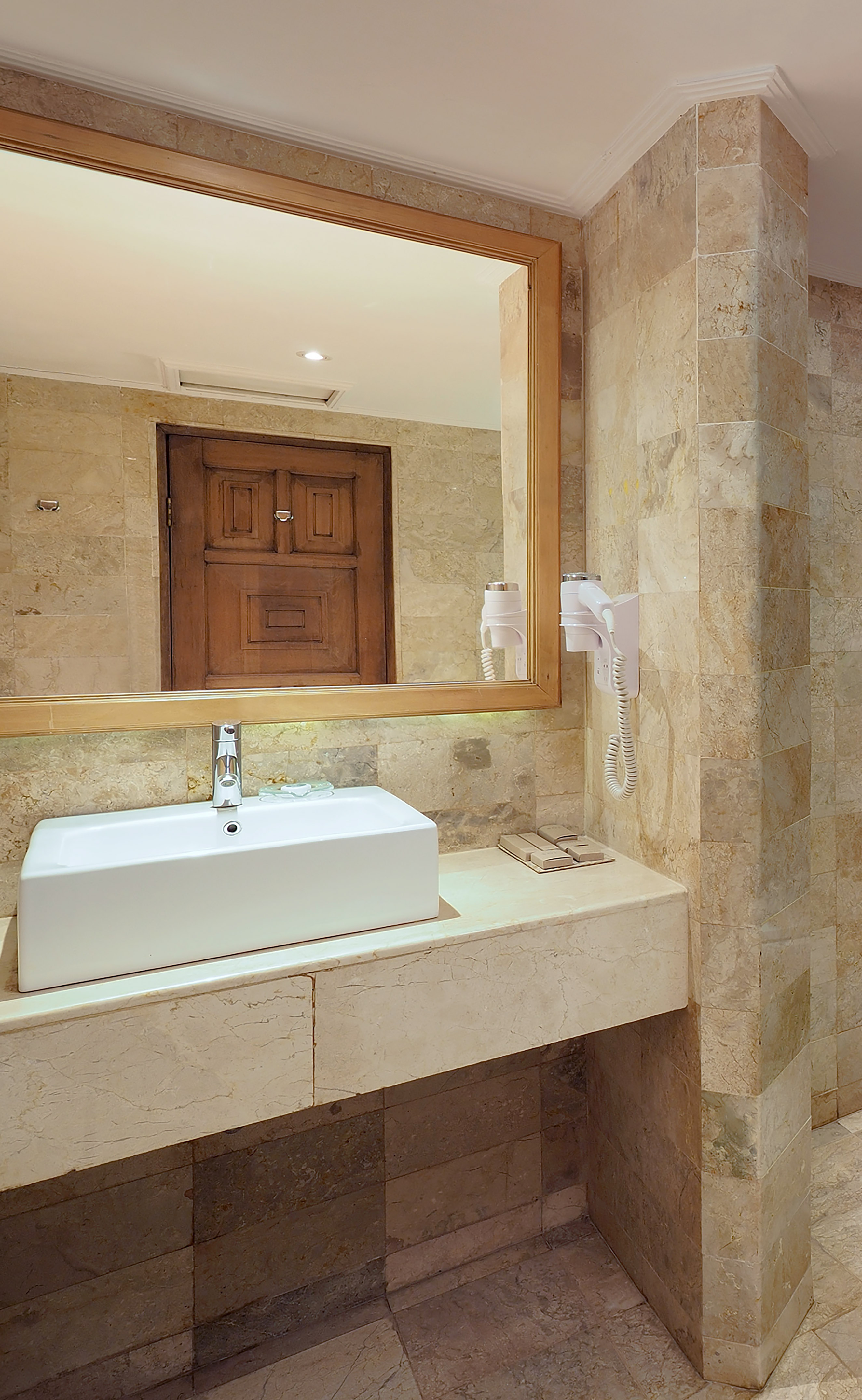 a bathroom with a mirror and sink