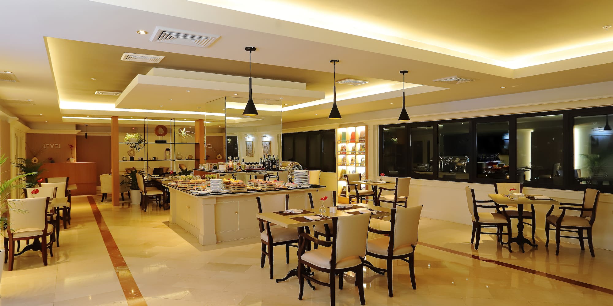 a room with a large table and chairs