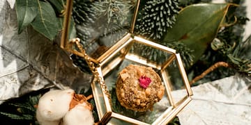 a gold box with a red flower inside