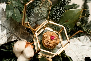 a gold box with a red flower inside