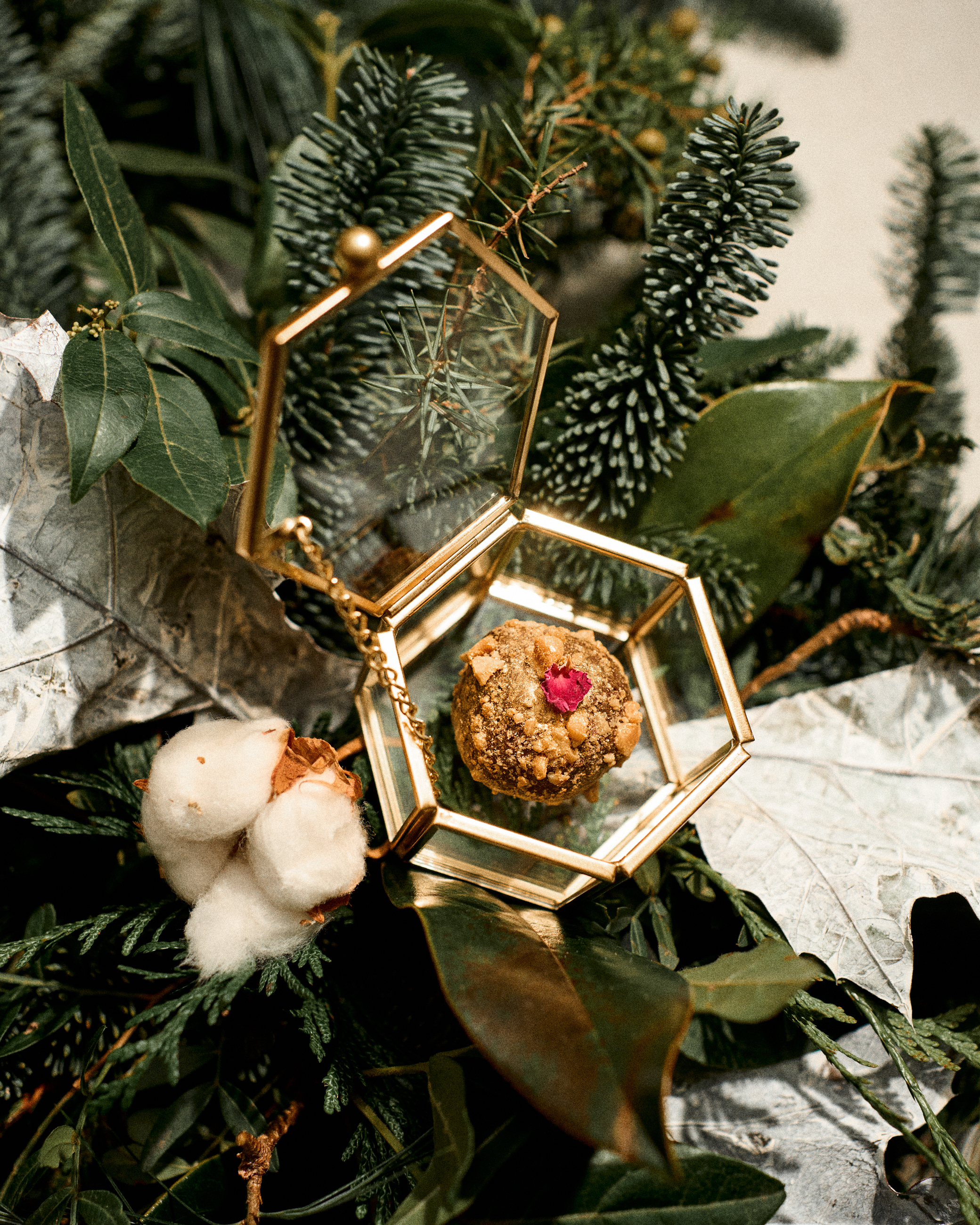 a gold box with a red flower inside