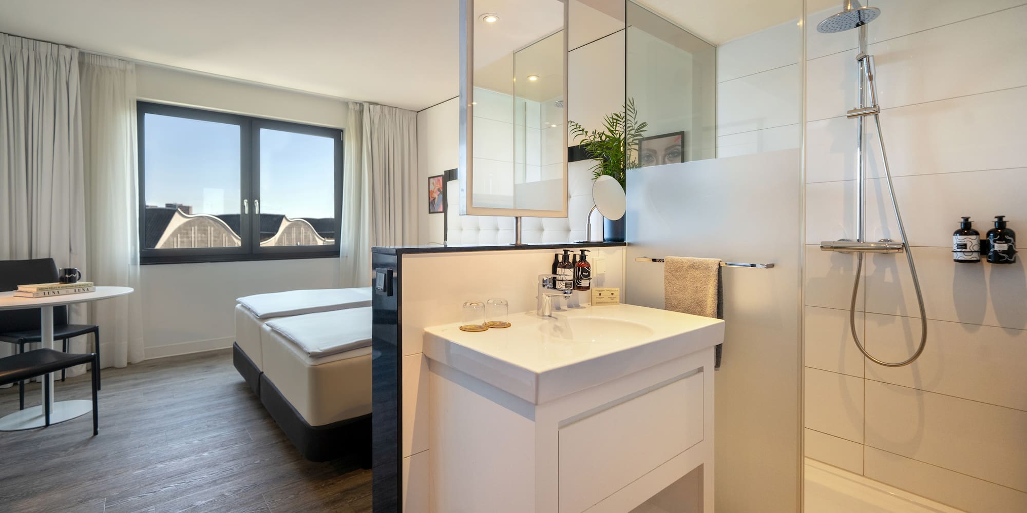 a bathroom with a shower and a bed